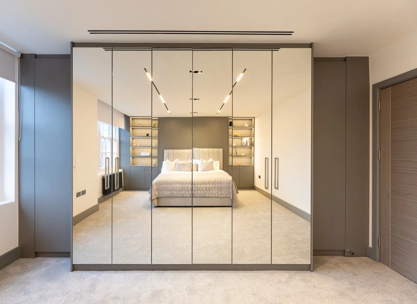 Bespoke fitted wardrobe floor ceiling mirrored doors — Kensington
