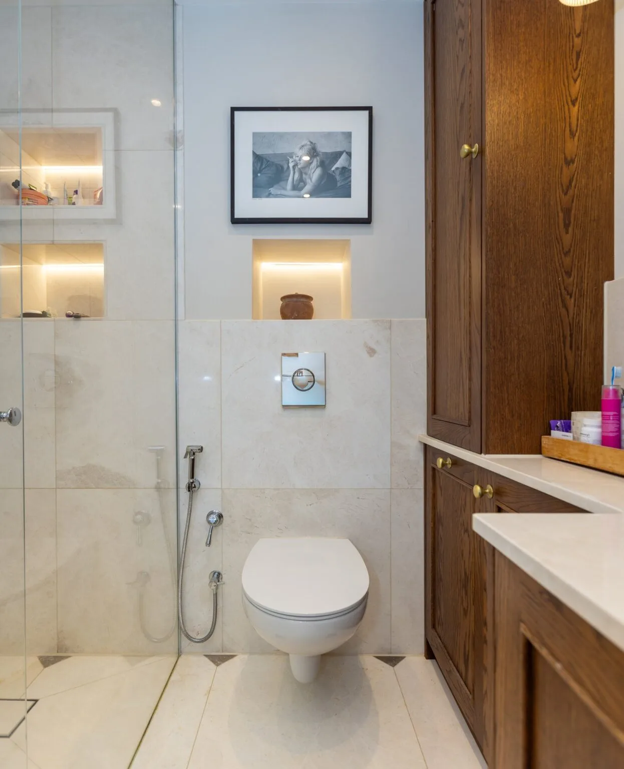 Oak bathroom cabinet beside walk-in shower enclosure — Phillimore Gardens, Kensington