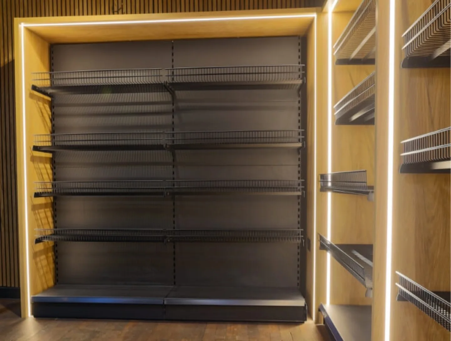 Recessed wall shelving in an oak frame with built-in LED strip lighting