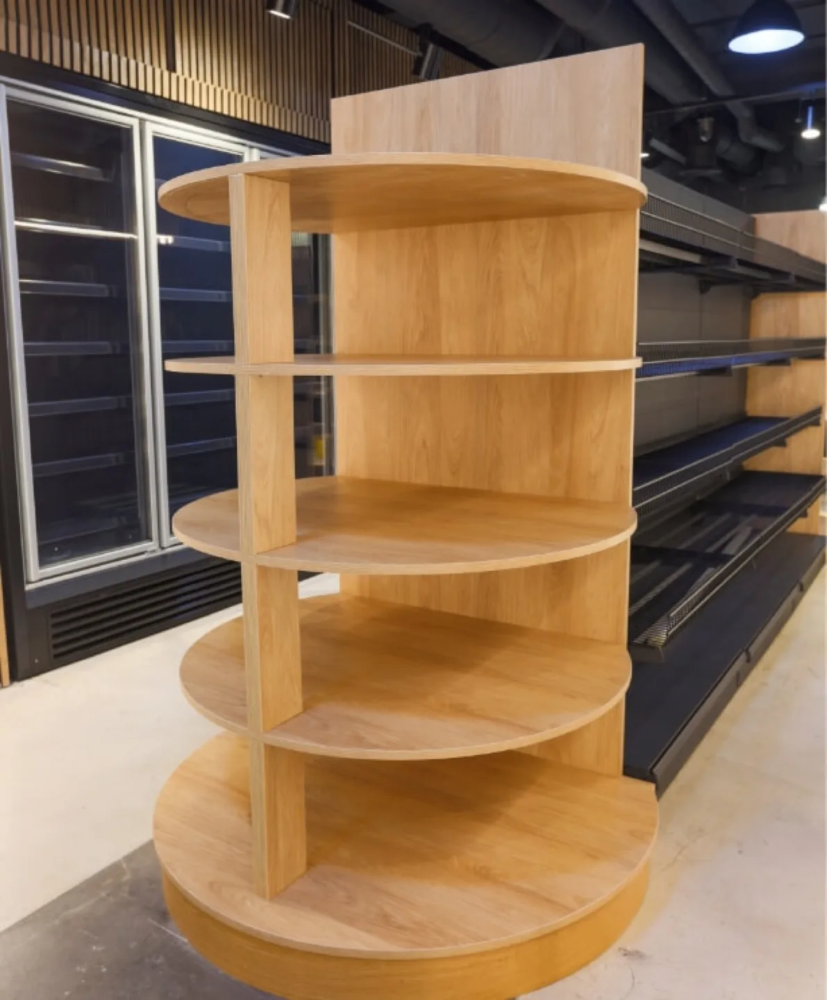 Freestanding circular oak display unit with tiered round shelves