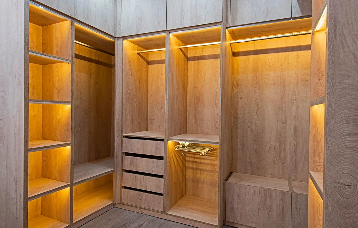 Walk-in wood wardrobe with integrated lighting
