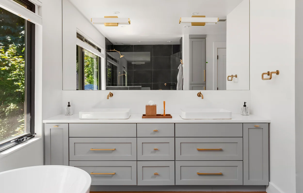 Bathroom cabinet with a large framed mirror