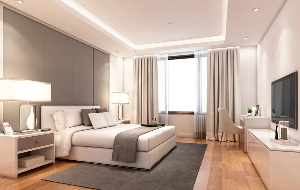 Beige bedroom with a bespoke headboard