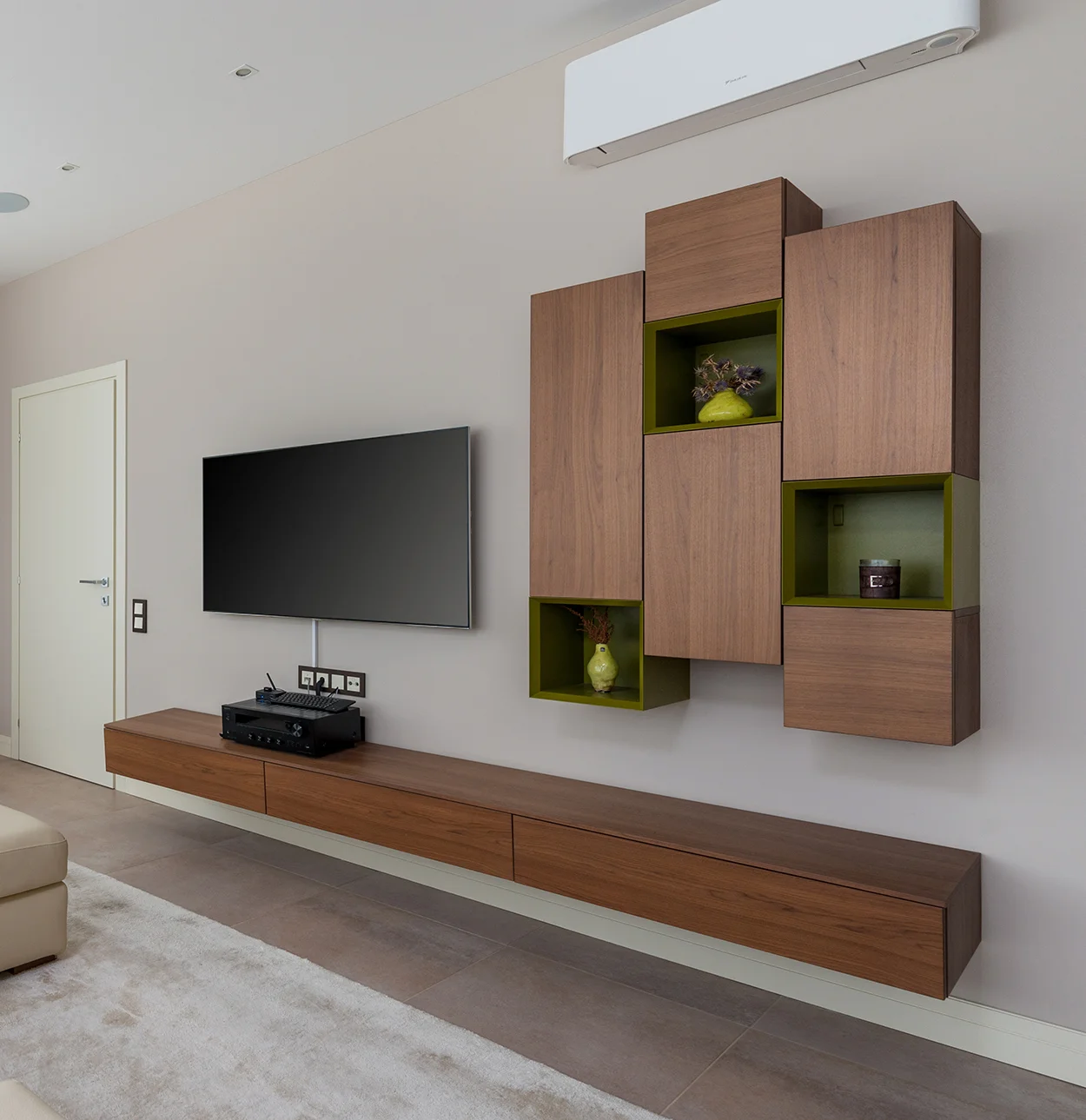 TV hung on the wall with bespoke cabinets