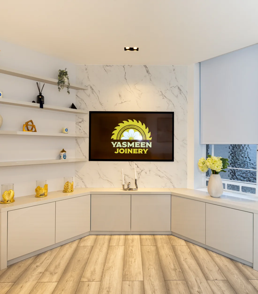 Corner TV media unit with a marble feature wall and lower cabinets