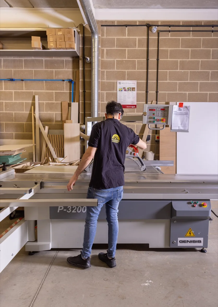 Craftsman working at the panel saw